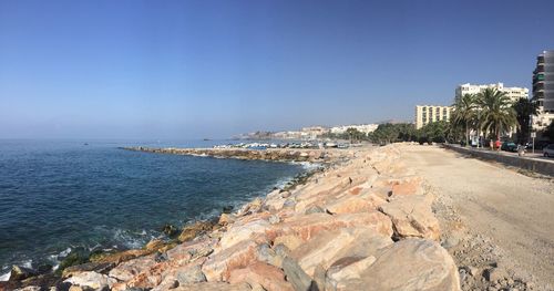 Scenic view of sea against clear blue sky