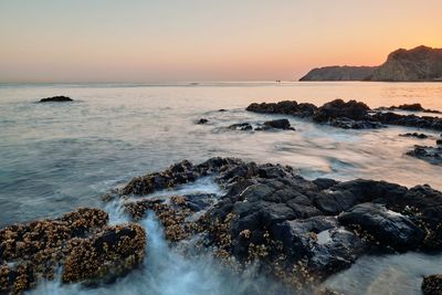 Scenic view of sea against sky during sunset