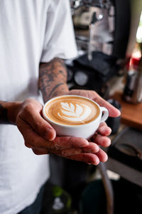 Woman holding coffee cup