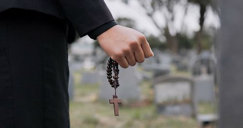 Midsection of man holding key