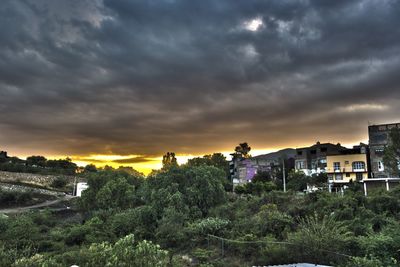 Scenic view of landscape against cloudy sky