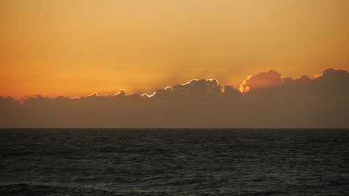 Scenic view of sea against clear sky during sunset