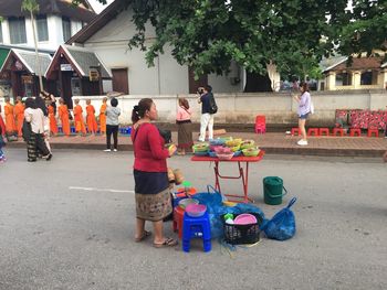 Group of people standing on street