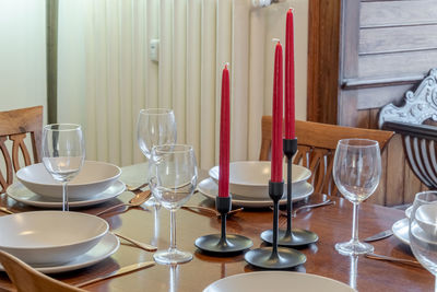 Detail of arranged table with plates and glasses