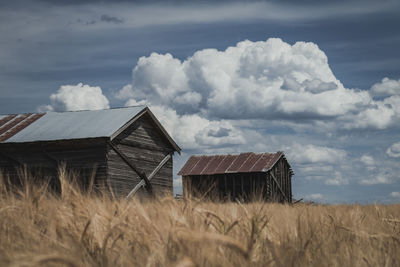 House on field against sky