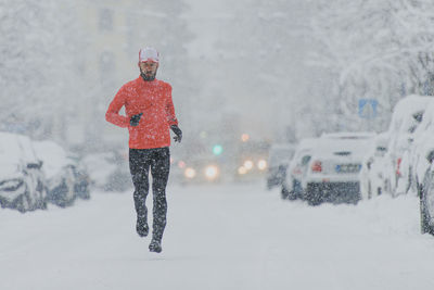 Man running on snowy land