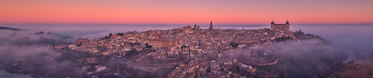 High angle view of city against sky during sunset