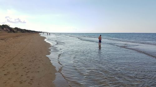 Scenic view of beach against sky