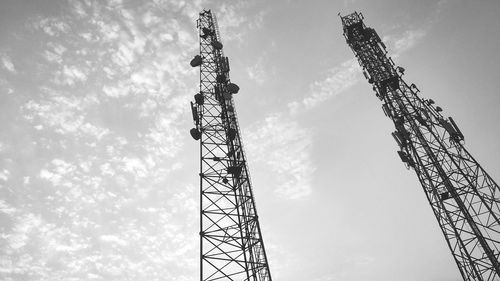 Low angle view of communications tower against sky