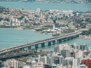 High angle view of river and buildings in city