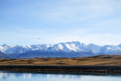 Scenic view of snowcapped mountains against sky