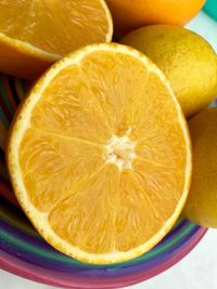 Tilt image of halved oranges in plate