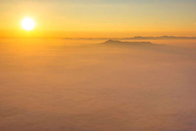 Scenic view of landscape against romantic sky at sunset