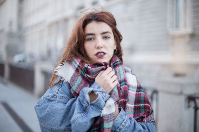 Portrait of young woman wearing warm clothing during winter