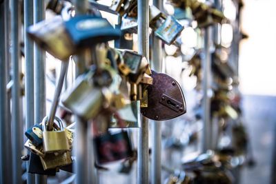 Close-up of padlocks hanging on metal