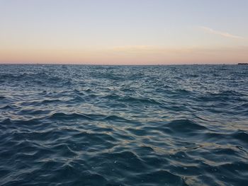 Scenic view of sea against clear sky during sunset