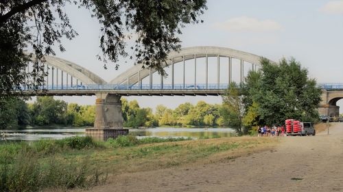 Bridge over river against sky