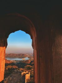 View of rock formation against sky in jaipur ,world heritage city . jal mahal is also visible .