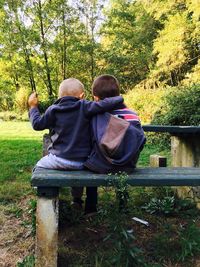 Rear view of friends on tree