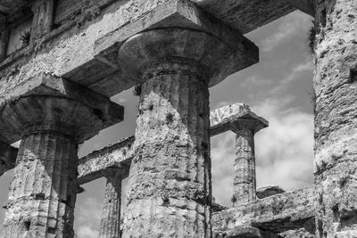 Low angle view of old ruin against sky in city
