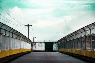 Empty road along bridge