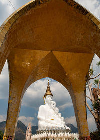 Low angle view of statue of building against sky