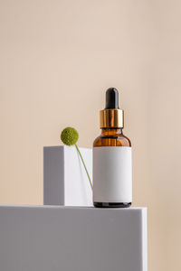 Close-up of beauty products against white background