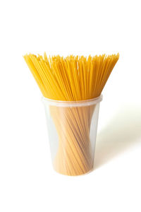 Close-up of yellow cake against white background