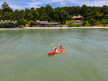 People kayaking in sea