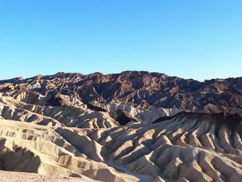 Scenic view of death valley national park against clear blue sky