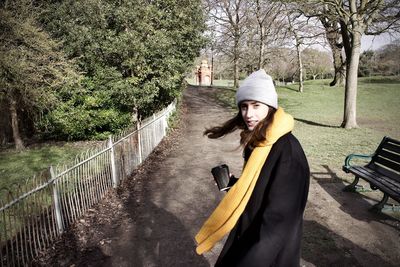 Portrait of woman in park during winter