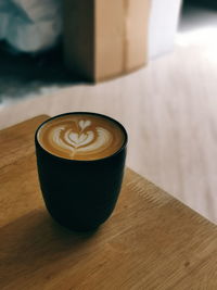 Close-up of cappuccino on table