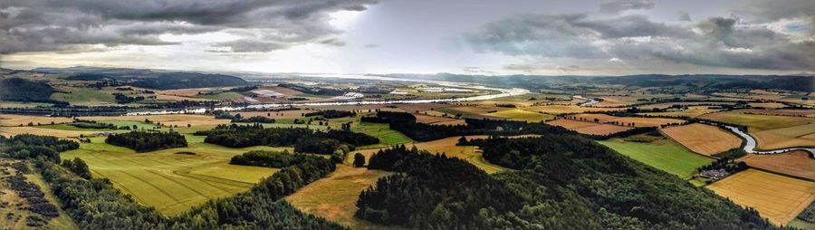 Aerial view of agricultural field against sky