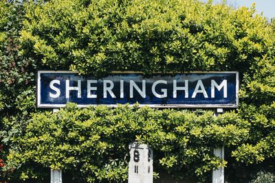 Information sign against trees