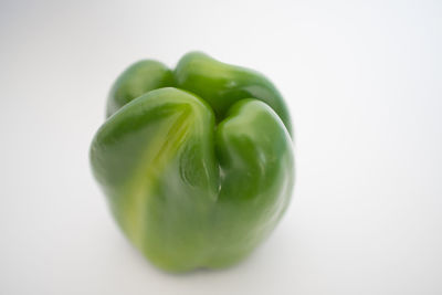 Close-up of green pepper against white background