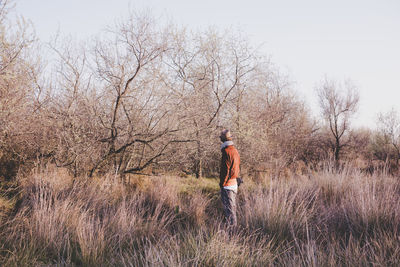 Full length of man standing on field against sky