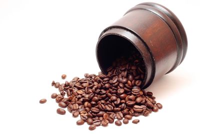 Close-up of coffee beans against white background