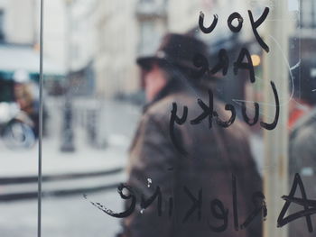 Close-up of texts on glass window