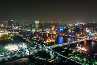 High angle view of illuminated buildings in city at night