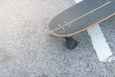 High angle view of skateboard on road