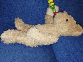 High angle view of stuffed toy on bed