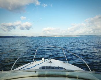 Cropped image of boat in sea against sky