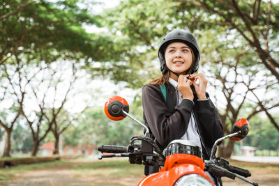 Young woman riding bicycle