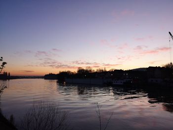 Scenic view of lake against romantic sky at sunset