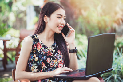 Young woman using mobile phone