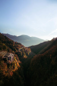 High angle view of trees and mountains against sky