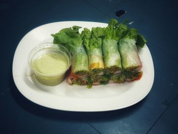 High angle view of vegetables in plate on table