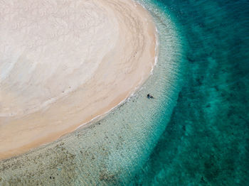 High angle view of surf on beach