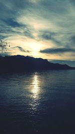 Reflection of clouds in water at sunset