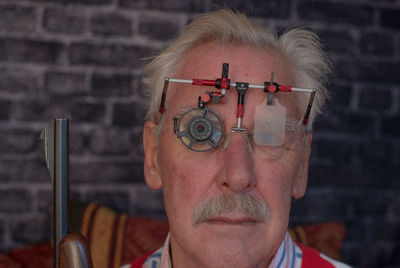 Close-up portrait of man wearing eyeglasses